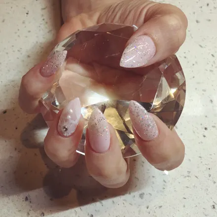 A soft pink gel manicure, finished and glossy
