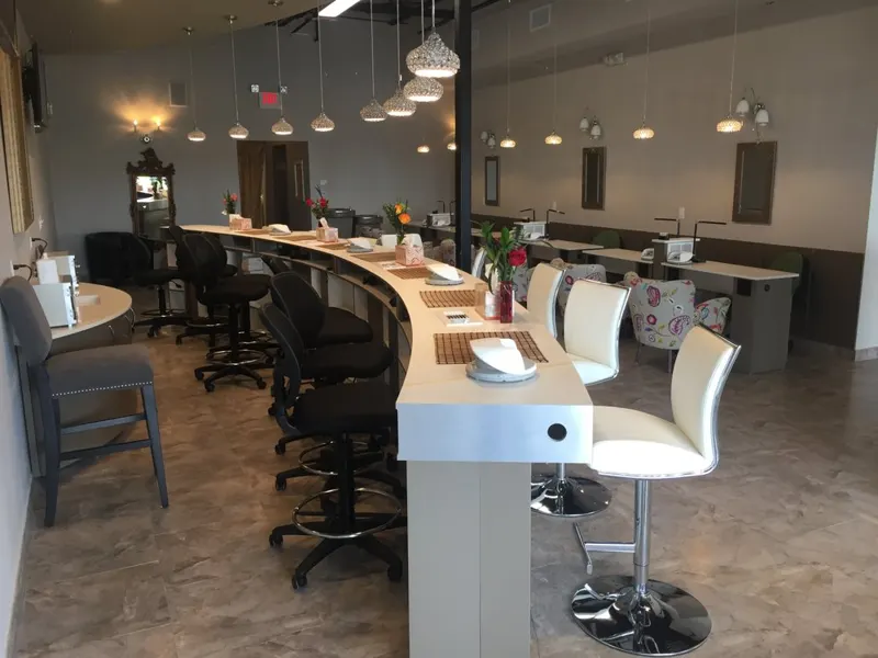 Inside our Northlake salon, rows of manicure tables and pedicure chairs in a bright, elegant room
